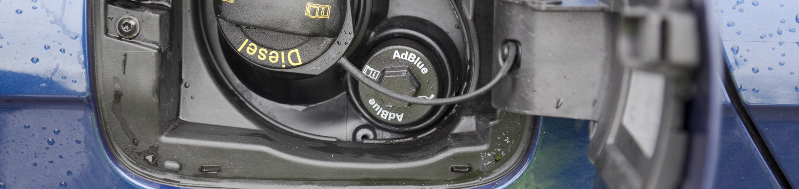 diesel and AdBlue filler cap in car